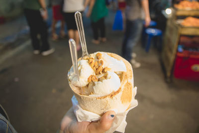 Person holding ice cream cone