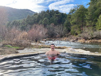 Portrait of shirtless man in water