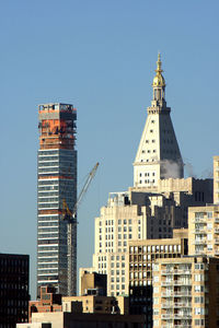 Low angle view of buildings against clear sky