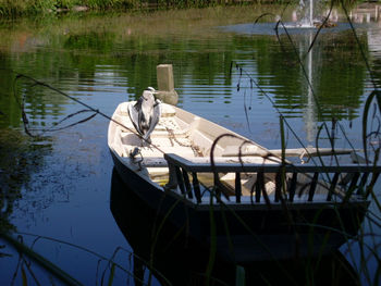 Boat moored in lake