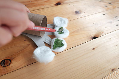 High angle view of person preparing food on table