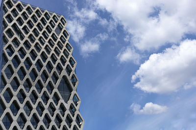 Low angle view of skyscraper against sky