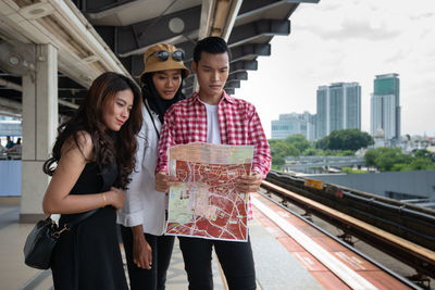 Young couple standing in city