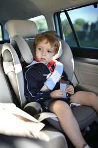 Boy sitting in car