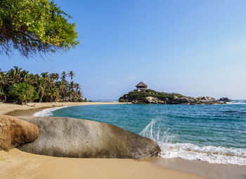 Scenic view of beach against clear sky