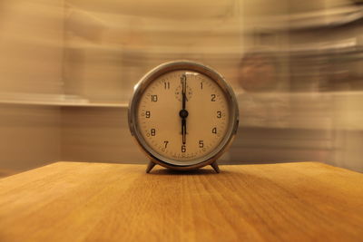 Close-up of clock on table