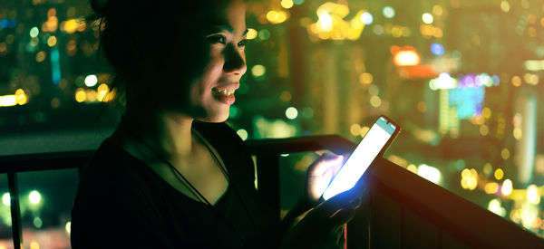 Man using mobile phone at night