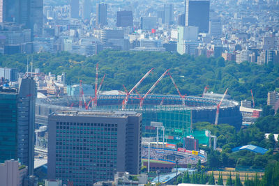 High angle view of buildings in city against sky