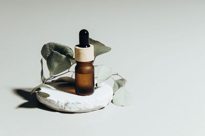 Close-up of bottle against white background