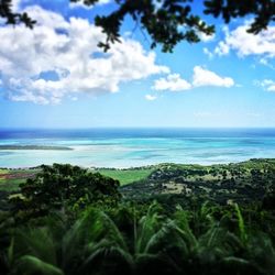 Scenic view of sea against cloudy sky