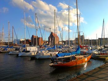 Boats moored at harbor