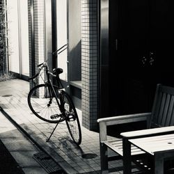 Bicycle on table against building in city