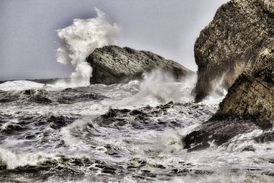 Sea waves splashing on rocks