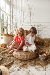 Children at easter with rabbits and ducks