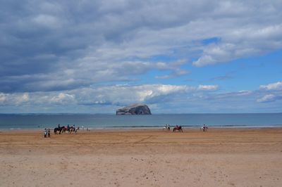 Scenic view of sea against cloudy sky