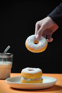 Midsection of man having breakfast on table
