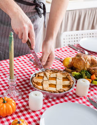 Midsection of man preparing food on table