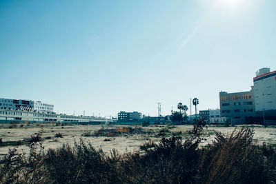 Buildings against clear sky