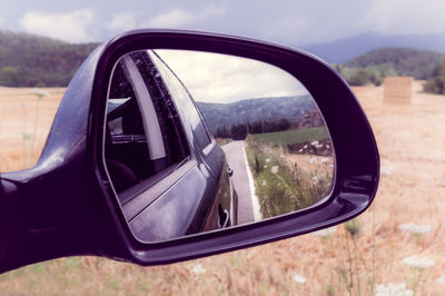 Reflection of car on side-view mirror