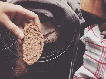 Human hand holding bread