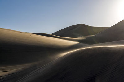 Scenic view of desert against clear sky