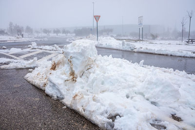 Snow covered road against sky