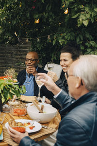 Man and woman having food on table