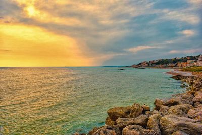 Scenic view of sea against sky at sunset