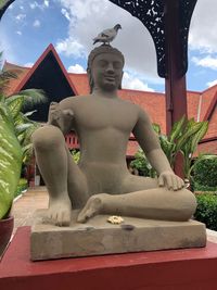 Statue of buddha against sky