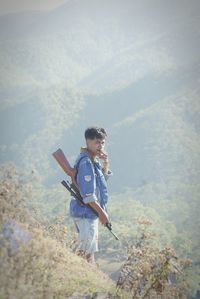 Full length of young man standing on land