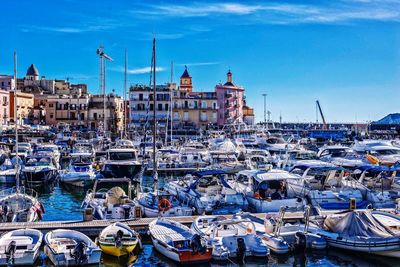 Boats moored at harbor