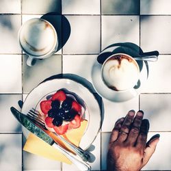 Hand holding coffee cup