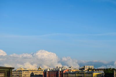 Panoramic view of buildings against blue sky