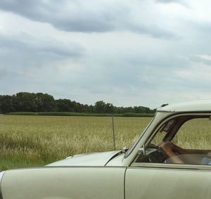 Cropped image of vehicle on landscape