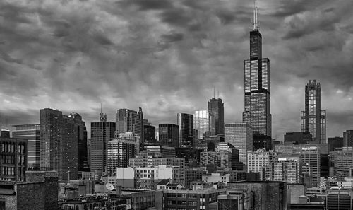 Modern buildings in city against sky