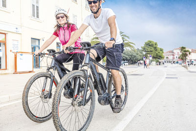 Bicycles riding bicycle on road in city