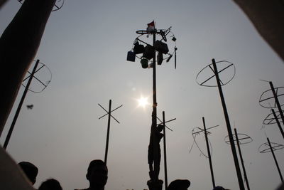 Low angle view of silhouette people against sky during sunset