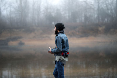 Photographer holding camera outdoors