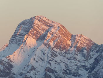 Scenic view of snowcapped mountains against clear sky