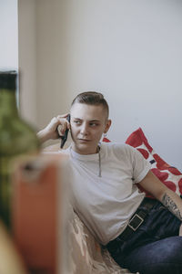 Portrait of young man looking at camera