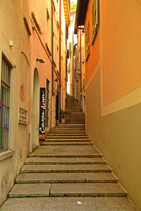 Narrow alley amidst buildings in city