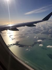 Aerial view of sea against sky during sunset