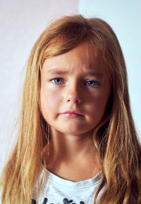 Close-up portrait of innocent girl with long hair