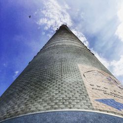 Low angle view of building against cloudy sky