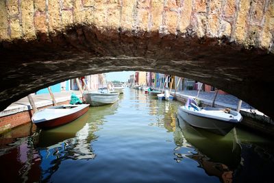 Boats moored in water