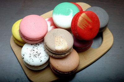 High angle view of multi colored macarons on table