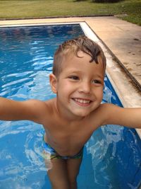 Smiling boy in swimming pool