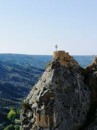 Rock formations on land against sky