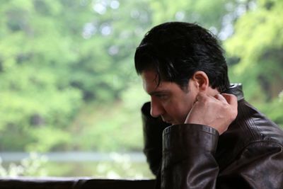 Side view of man wearing leather jacket