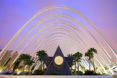 Digital composite image of illuminated building against sky